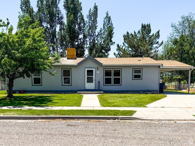 912 S W Redview Dr, Monroe, UT 84754 - single story home featuring an attached carport, a front yard, driveway, and a chimney