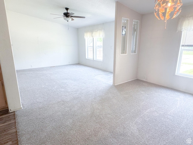 912 S W Redview Dr, Monroe, UT 84754 - empty room featuring healthy amount of natural light, carpet flooring, and ceiling fan
