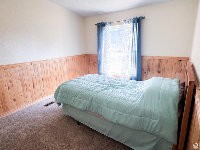 912 S W Redview Dr, Monroe, UT 84754 - bedroom with wooden walls, a wainscoted wall, and carpet floors