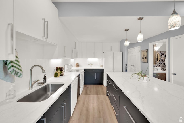 468 N E St, Salt Lake City, UT 84103 - kitchen featuring white appliances, white cabinets, dark cabinetry, and light wood-style flooring