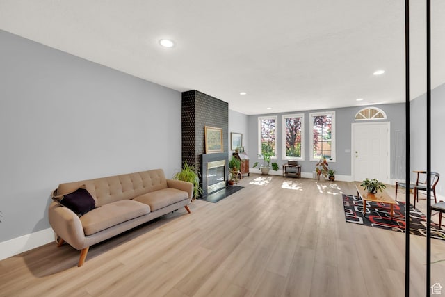 468 N E St, Salt Lake City, UT 84103 - living area with wood finished floors, recessed lighting, and a brick fireplace