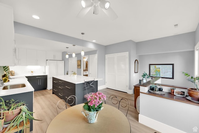 468 N E St, Salt Lake City, UT 84103 - dining area with light wood-style floors, a ceiling fan, and recessed lighting
