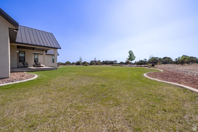 10371 N 400 W, Roosevelt, UT 84066 - view of green lawn featuring a patio and a ceiling fan