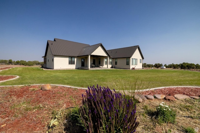 10371 N 400 W, Roosevelt, UT 84066 - back of property featuring a yard and a metal roof