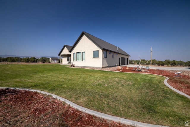 10371 N 400 W, Roosevelt, UT 84066 - view of property exterior with a lawn and stucco siding