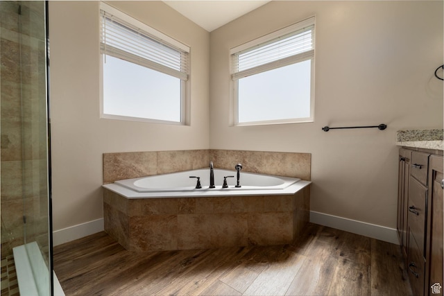 10371 N 400 W, Roosevelt, UT 84066 - full bathroom with wood finished floors, vanity, a bath, and tiled shower