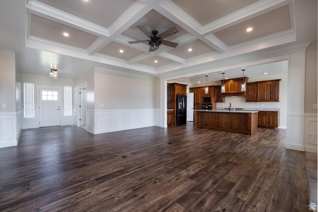 10371 N 400 W, Roosevelt, UT 84066 - unfurnished living room with a decorative wall, coffered ceiling, beam ceiling, a ceiling fan, and wainscoting