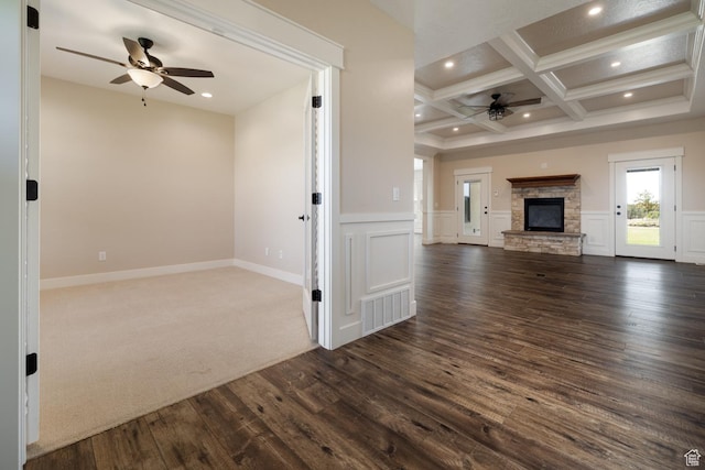10371 N 400 W, Roosevelt, UT 84066 - unfurnished living room with a ceiling fan, coffered ceiling, dark wood-style floors, beam ceiling, and a stone fireplace