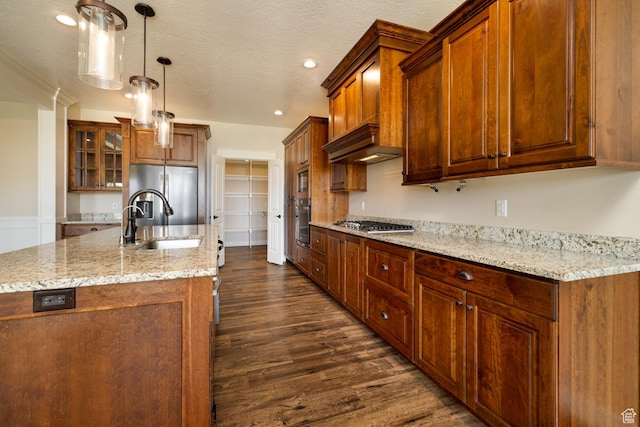 10371 N 400 W, Roosevelt, UT 84066 - kitchen with appliances with stainless steel finishes, dark wood-style flooring, premium range hood, a center island with sink, and glass insert cabinets