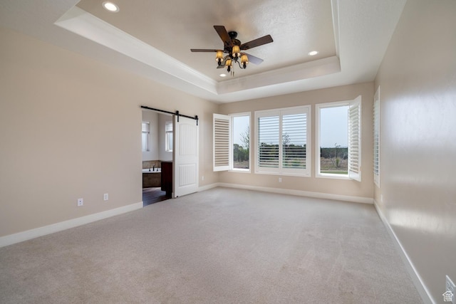 10371 N 400 W, Roosevelt, UT 84066 - carpeted empty room featuring a tray ceiling, recessed lighting, ceiling fan, and a barn door