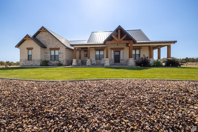 10371 N 400 W, Roosevelt, UT 84066 - view of front of property featuring stone siding, stucco siding, a front lawn, and a metal roof