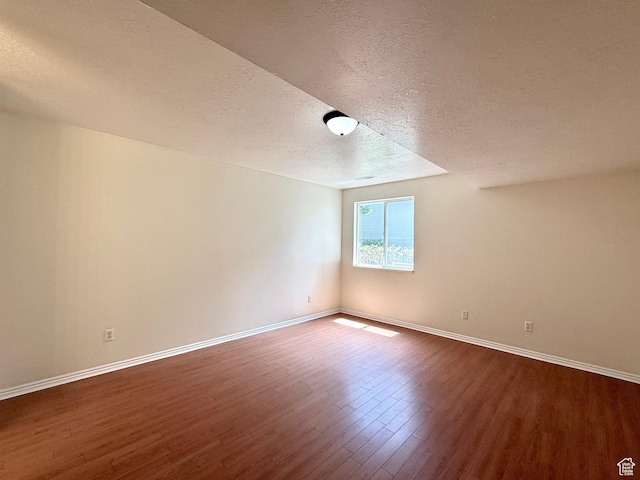 2421 N 400 E Unit E7, North Ogden, UT 84414 - empty room with a textured ceiling and dark wood finished floors