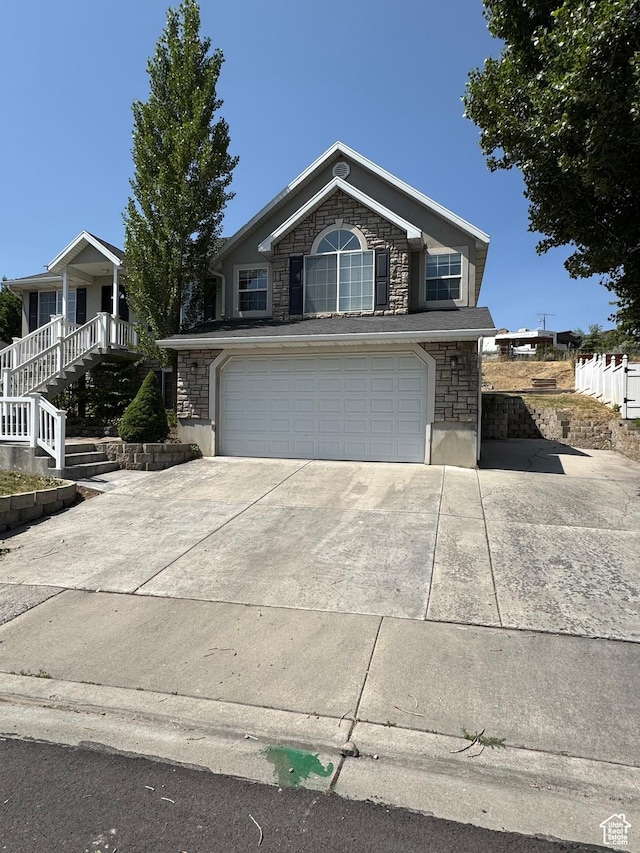584 S Loafer Dr, Payson, UT 84651 - view of front of property with stone siding, a garage, and concrete driveway