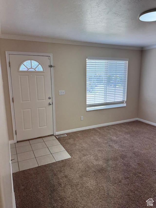 584 S Loafer Dr, Payson, UT 84651 - entrance foyer with healthy amount of natural light, light carpet, ornamental molding, and a textured ceiling