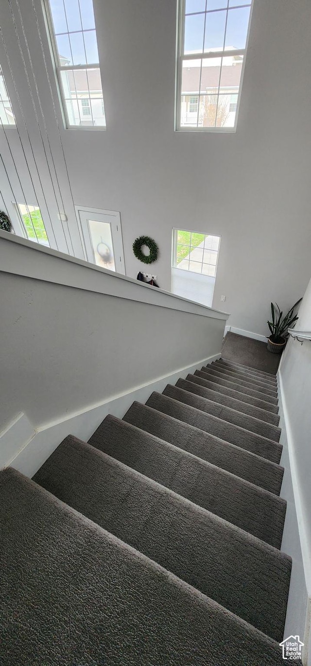 5332 W Scout Plane Ln, South Jordan, UT 84009 - stairway featuring plenty of natural light and a towering ceiling