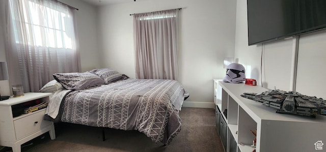 5332 W Scout Plane Ln, South Jordan, UT 84009 - bedroom featuring dark carpet and baseboards