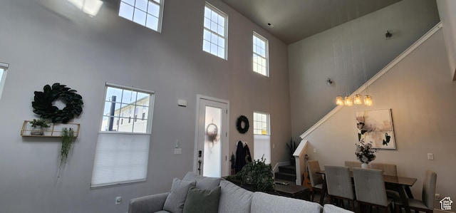 5332 W Scout Plane Ln, South Jordan, UT 84009 - living room with a towering ceiling, stairway, and plenty of natural light