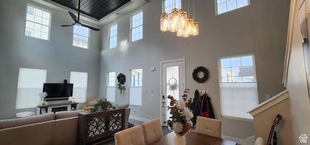 5332 W Scout Plane Ln, South Jordan, UT 84009 - dining room featuring a high ceiling, a chandelier, healthy amount of natural light, wood finished floors, and ceiling fan