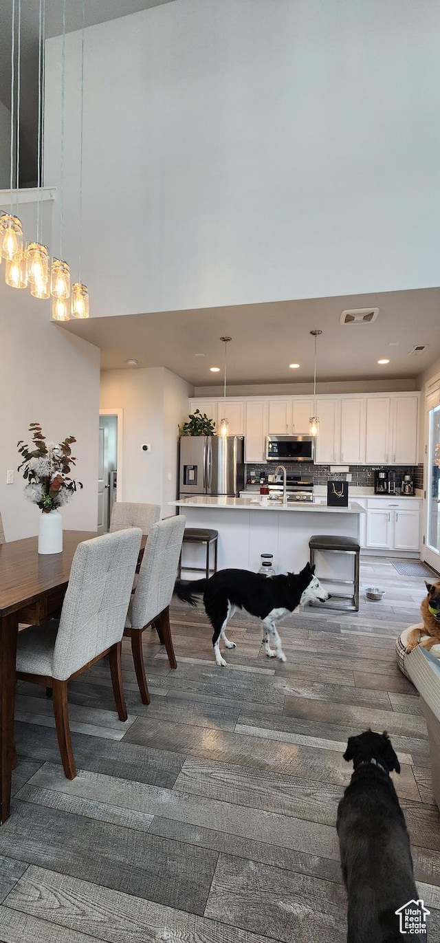 5332 W Scout Plane Ln, South Jordan, UT 84009 - dining space with a high ceiling and recessed lighting