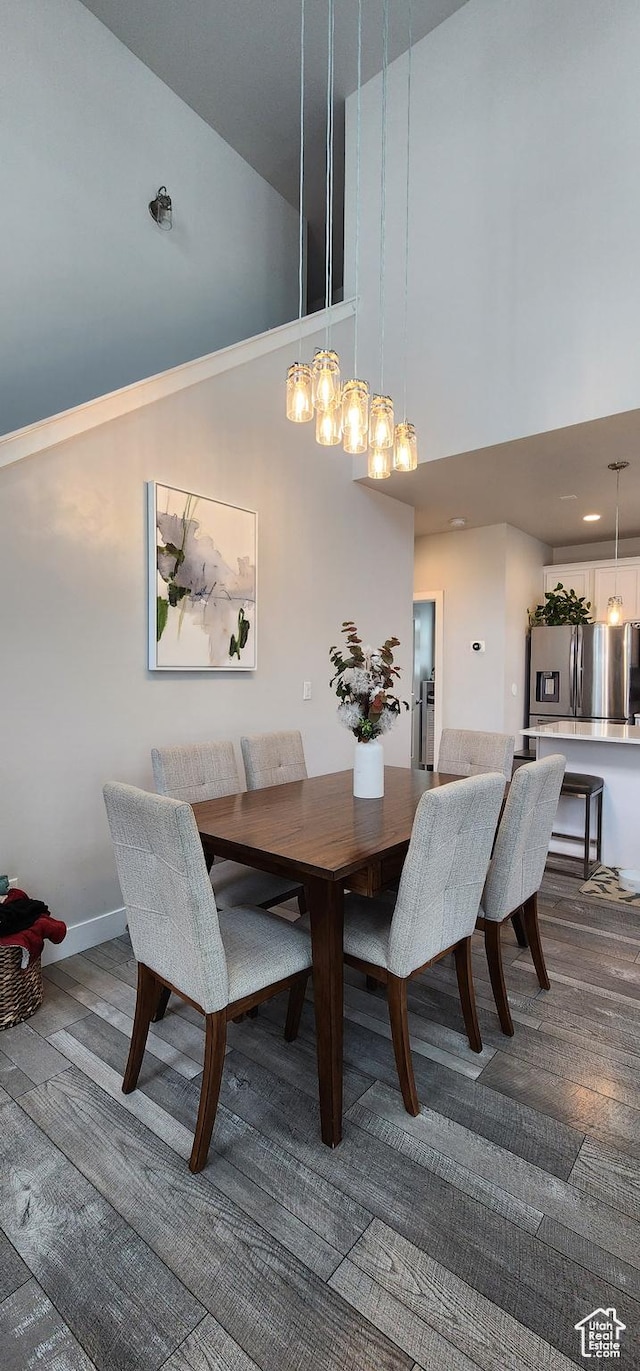 5332 W Scout Plane Ln, South Jordan, UT 84009 - dining space featuring a towering ceiling and dark wood finished floors