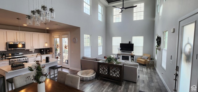 5332 W Scout Plane Ln, South Jordan, UT 84009 - living area with a high ceiling, dark wood-style floors, and ceiling fan