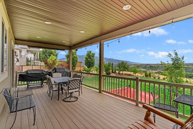 469 W 5700 S, Washington Terrace, UT 84405 - wooden terrace with a mountain view, outdoor dining area, and a grill