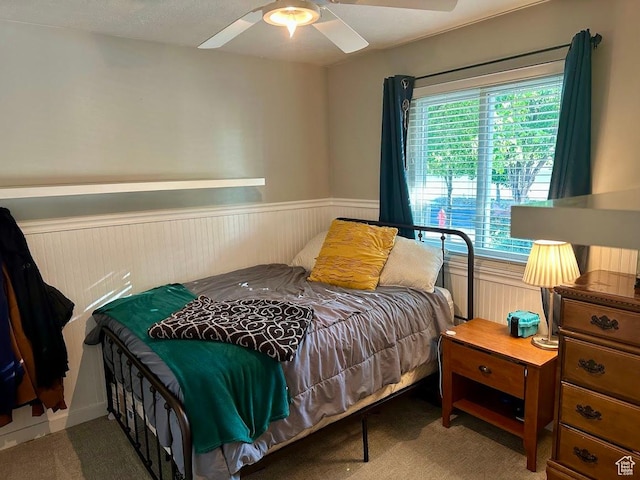 8675 S Pebblecreek Rd, West Jordan, UT 84081 - carpeted bedroom featuring wainscoting and a ceiling fan