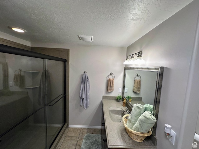 8675 S Pebblecreek Rd, West Jordan, UT 84081 - bathroom featuring vanity, a shower stall, a textured ceiling, and tile patterned flooring