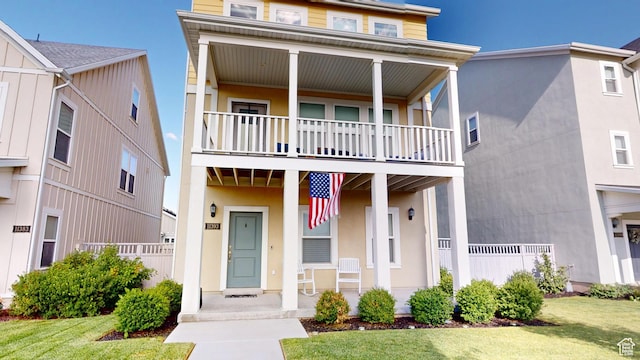 11393 S Prosperity Rd W, South Jordan, UT 84009 - view of front of property featuring a balcony, covered porch, and stucco siding