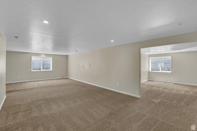 4301 N Majors St E, Eagle Mountain, UT 84005 - empty room featuring a textured ceiling, carpet, and recessed lighting