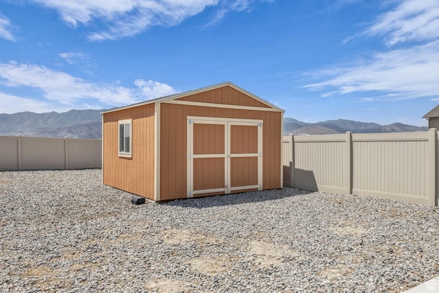 4301 N Majors St E, Eagle Mountain, UT 84005 - view of shed featuring a mountain view and a fenced backyard