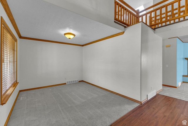 4301 N Majors St E, Eagle Mountain, UT 84005 - spare room featuring ornamental molding, carpet floors, and a textured ceiling
