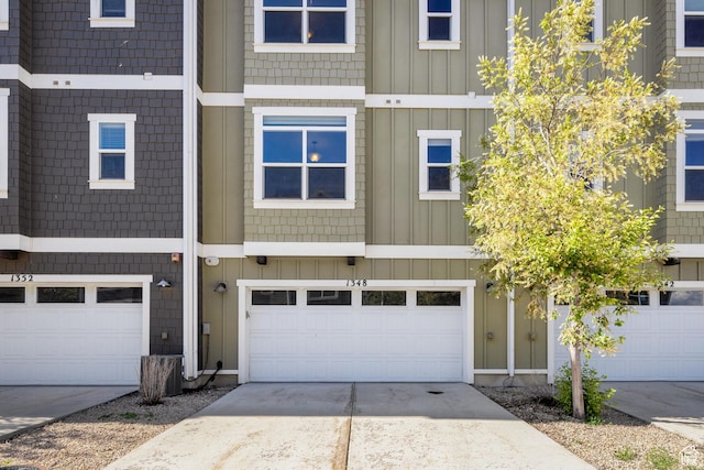 1348 Fiddich Glen Ln, Park City, UT 84098 - townhome / multi-family property featuring board and batten siding, concrete driveway, and a garage