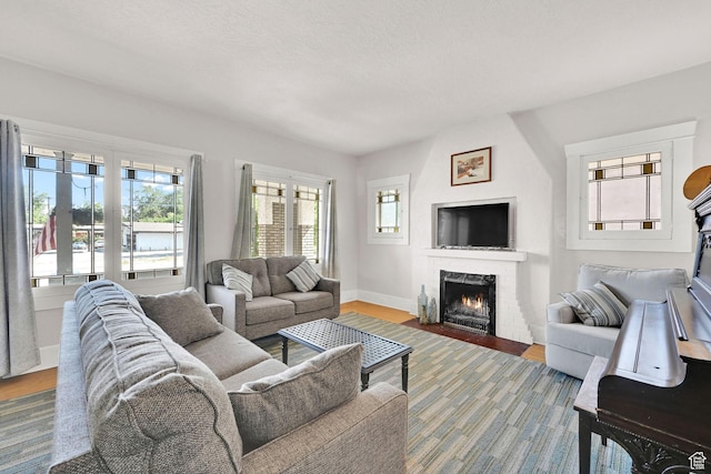 1203 25th St, Ogden, UT 84401 - living room with a brick fireplace and wood finished floors