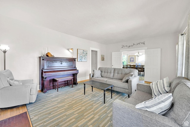 1203 25th St, Ogden, UT 84401 - living room featuring a chandelier and wood finished floors
