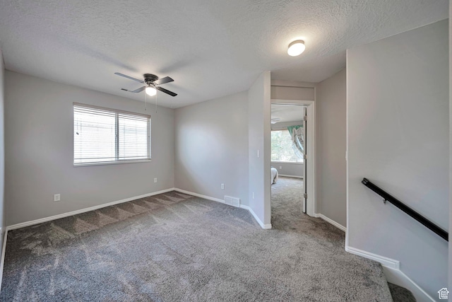 5961 W Chiswick Ct, West Jordan, UT 84081 - empty room featuring a textured ceiling, carpet, and a ceiling fan
