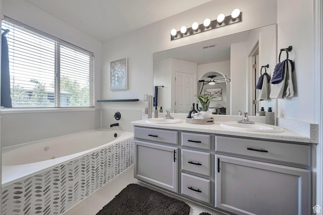 5961 W Chiswick Ct, West Jordan, UT 84081 - bathroom featuring double vanity, a bath, and tile patterned flooring
