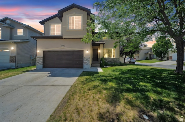 5961 W Chiswick Ct, West Jordan, UT 84081 - traditional home featuring stucco siding, stone siding, a garage, and a yard