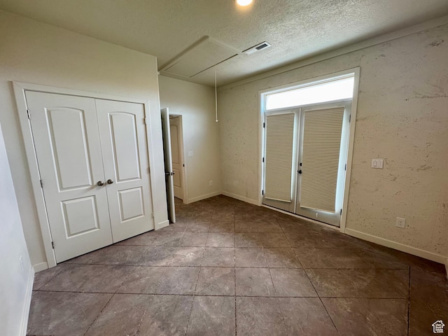 20473 W 4500 S, Duchesne, UT 84021 - tiled spare room with attic access and a textured ceiling