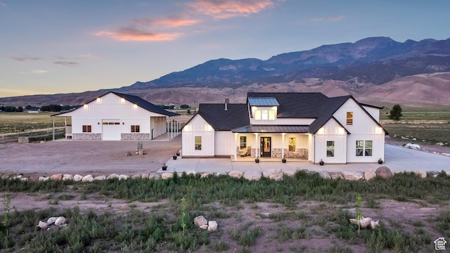 1952 N Sr 118, Monroe, UT 84754 - modern inspired farmhouse with a standing seam roof, a metal roof, a mountain view, a porch, and stone siding