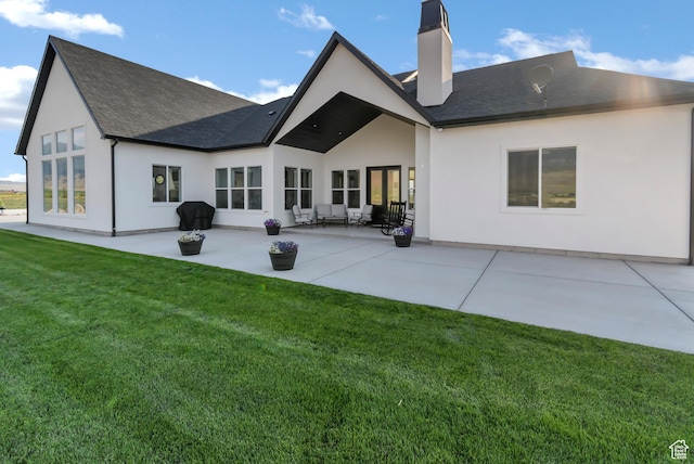 1952 N Sr 118, Monroe, UT 84754 - rear view of house featuring a chimney, a patio area, a lawn, and stucco siding