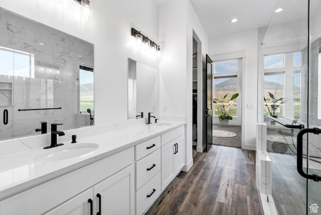 1952 N Sr 118, Monroe, UT 84754 - bathroom featuring double vanity, a marble finish shower, recessed lighting, and wood finished floors