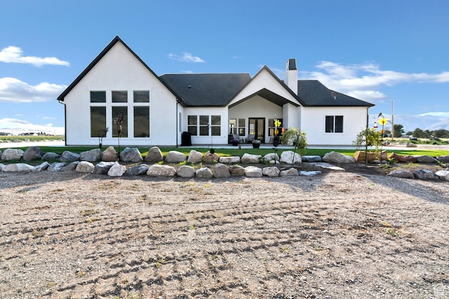 1952 N Sr 118, Monroe, UT 84754 - back of house with stucco siding, a chimney, and a patio
