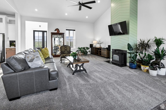 1952 N Sr 118, Monroe, UT 84754 - living area featuring a wood stove, carpet, recessed lighting, ceiling fan, and high vaulted ceiling