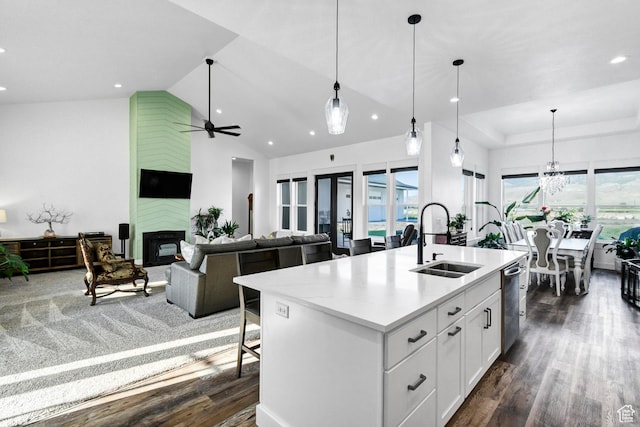 1952 N Sr 118, Monroe, UT 84754 - kitchen featuring dark wood-style flooring, recessed lighting, a kitchen island with sink, a fireplace, and white cabinets
