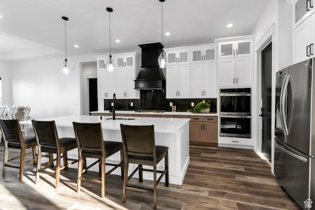 1952 N Sr 118, Monroe, UT 84754 - kitchen featuring stainless steel appliances, decorative backsplash, premium range hood, light countertops, and dark wood-style flooring