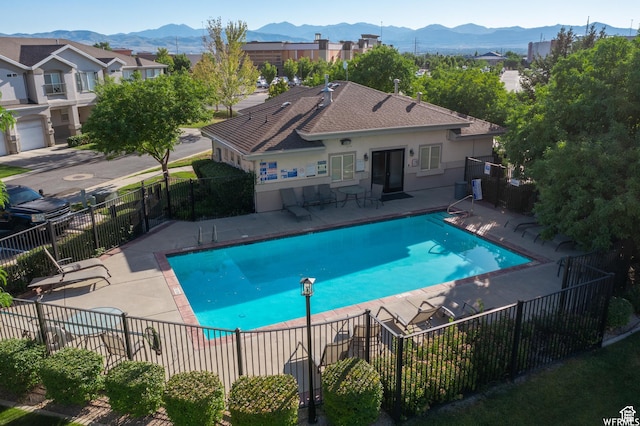 12102 S Mountain Peak Dr, Draper, UT 84020 - community pool with a mountain view and a patio