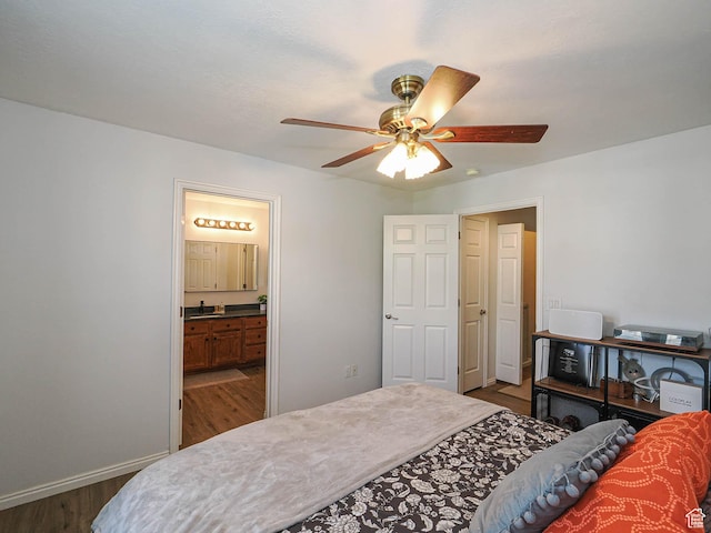 12102 S Mountain Peak Dr, Draper, UT 84020 - bedroom featuring dark wood finished floors, ensuite bath, and a ceiling fan