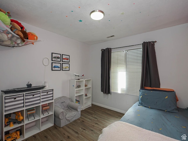 12102 S Mountain Peak Dr, Draper, UT 84020 - bedroom with wood finished floors and baseboards