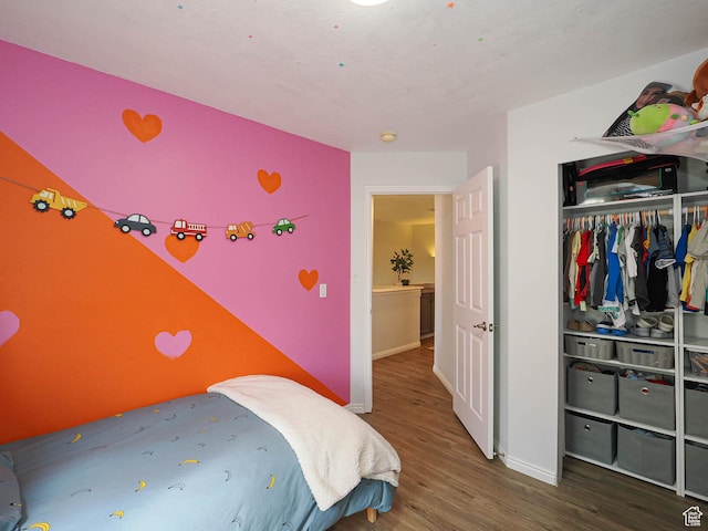 12102 S Mountain Peak Dr, Draper, UT 84020 - bedroom featuring wood finished floors and a closet